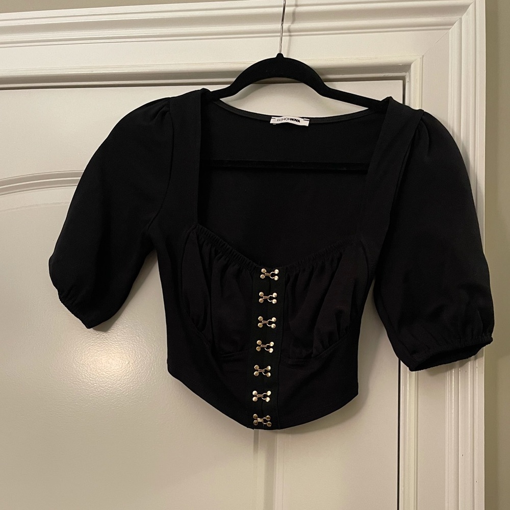 Puff sleeve black crop top with gold detail!